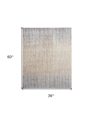 Homeroots 3' X 5' Ivory Tan And Blue Ombre Power Loom Worn Faded Area Rug Gray Polyester 567315