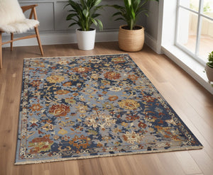 HomeRoots 4' Hand-Knotted Wool Floral Area Rug in Blue Gray and Red with Fringe - Timeless Elegance for Any Room 4' X 6' 567361