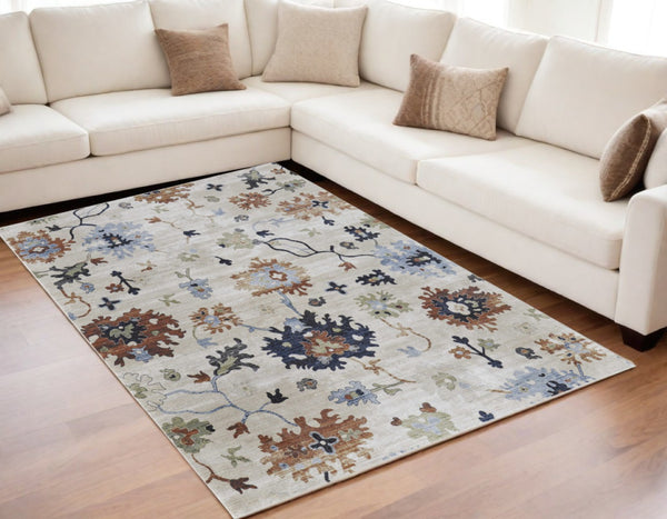 HomeRoots 5' Elegant Ivory Red and Blue Floral Area Rug - Timeless Power Loom Design for Stylish Homes 5' X 8' 567395