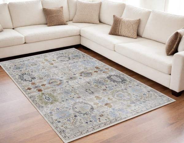 HomeRoots 5' Elegant Floral Power Loom Area Rug in Ivory, Red & Blue - Stain Resistant & Durable Design 5' X 8' 567415