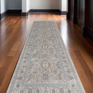 Homeroots 12' Silver Taupe And Blue Oriental Power Loom Worn Faded Runner Rug With Fringe Taupe Polyester 567427