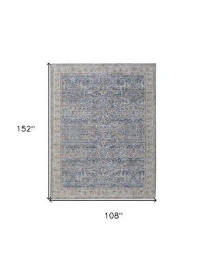 HomeRoots 5' Blue Taupe and Ivory Ikat Distressed Area Rug with Fringed Tassels for Chic Home Decor Style 9' X 13' 567559