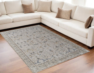 HomeRoots 5' Blue Taupe and Ivory Ikat Distressed Area Rug with Fringed Tassels for Chic Home Decor Style 5' X 8' 567561