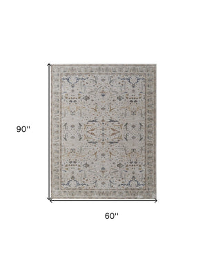 HomeRoots 5' Blue Taupe and Ivory Ikat Distressed Area Rug with Fringed Tassels for Chic Home Decor Style 5' X 8' 567561