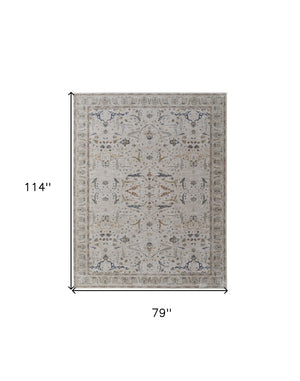 HomeRoots 5' Blue Taupe and Ivory Ikat Distressed Area Rug with Fringed Tassels for Chic Home Decor Style 7' X 10' 567562