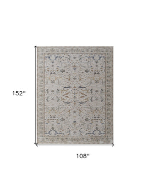 HomeRoots 5' Blue Taupe and Ivory Ikat Distressed Area Rug with Fringed Tassels for Chic Home Decor Style 9' X 13' 567564