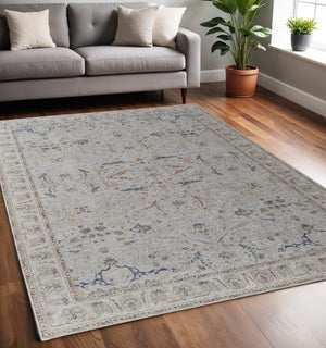 HomeRoots 5' Blue Taupe and Ivory Ikat Distressed Area Rug with Fringed Tassels for Chic Home Decor Style 5' X 8' 567566