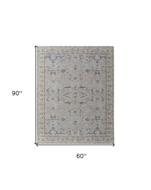 HomeRoots 5' Blue Taupe and Ivory Ikat Distressed Area Rug with Fringed Tassels for Chic Home Decor Style 5' X 8' 567566