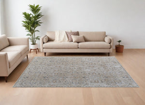 HomeRoots 5' Ivory Taupe and Blue Abstract Area Rug - Power Loomed with Fringed Tassels for Modern Style 7' X 10' 567577