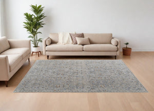 HomeRoots 5' Modern Abstract Ivory Tan and Blue Area Rug with Fringe – Durable, Stylish, and Easy Care 9' X 13' 567584