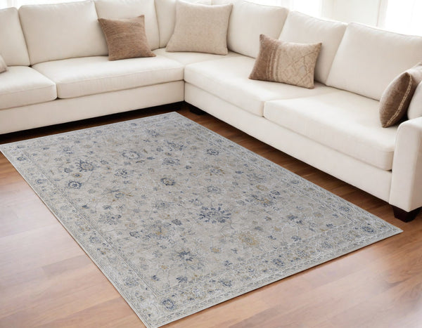 Homeroots 5' X 8' Ivory Taupe And Blue Floral Power Loom Worn Faded Area Rug With Fringe Ivory Polyester 567586