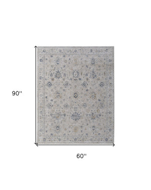 Homeroots 5' X 8' Ivory Taupe And Blue Floral Power Loom Worn Faded Area Rug With Fringe Ivory Polyester 567586