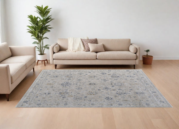 Homeroots 7' X 10' Ivory Taupe And Blue Floral Power Loom Worn Faded Area Rug With Fringe Ivory Polyester 567587