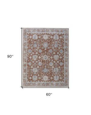 Homeroots 5' X 8' Red Blue And Ivory Floral Power Loom Worn Faded Area Rug With Fringe Red Polyester 567591