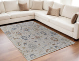 Homeroots 5' X 8' Ivory Blue And Gold Floral Power Loom Worn Faded Area Rug With Fringe Ivory Polyester 567595