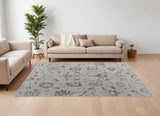 Homeroots 7' X 10' Ivory Blue And Gold Floral Power Loom Worn Faded Area Rug With Fringe Ivory Polyester 567596