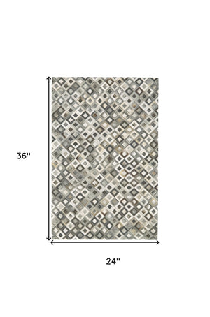 HomeRoots 2' Black Gray and White Faux Cowhide Geometric Area Rug - Modern Rustic Charm for Any Space 2' X 3' 567700