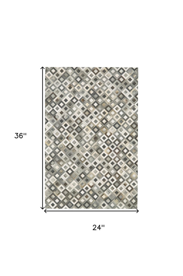 HomeRoots 2' Black Gray and White Faux Cowhide Geometric Area Rug - Modern Rustic Charm for Any Space 2' X 3' 567700