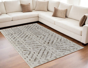 HomeRoots 4' Modern Ivory and Brown Geometric Area Rug - Stain Resistant, Easy Care for High-Traffic Spaces 5' X 8' 567804