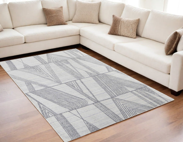 HomeRoots 4' Hand Woven Black and Ivory Abstract Area Rug – Modern Elegance for Cozy Spaces and High Traffic Areas 5' X 8' 567852