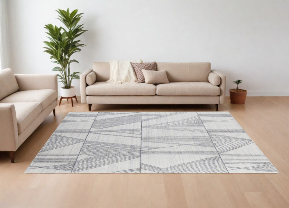 HomeRoots 4' Hand Woven Black and Ivory Abstract Area Rug – Modern Elegance for Cozy Spaces and High Traffic Areas 10' X 14' 567855