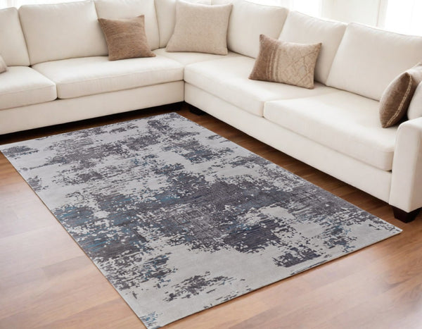HomeRoots 4' Transform Your Space with a Soft Wool-Blend Abstract Area Rug in Ivory, Brown, and Blue Tones 5' X 8' 567874