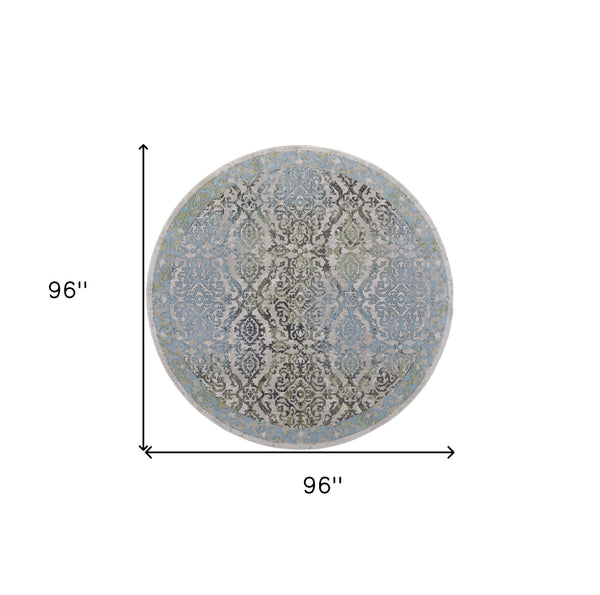 Homeroots 8' Blue Green And Gray Floral Power Loom Worn Faded Round Rug Blue Polypropylene 567899