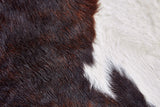 Homeroots 4' X 5' Brown And White Cowhide Animal Print Power Loom Area Rug Brown Cowhide 567901