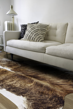 HomeRoots 4' Brown Cowhide Animal Print Area Rug - Rustic Charm Meets Modern Style for Any Room Decor 567902