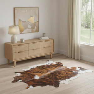 HomeRoots 4' Brown Cowhide Animal Print Power Loom Area Rug – Stylish, Durable, and Easy to Maintain for Any Room 567903