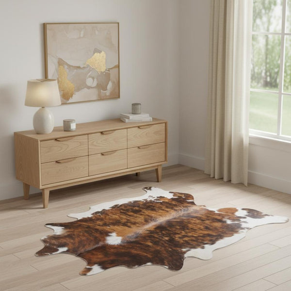 HomeRoots 4' Brown Cowhide Animal Print Power Loom Area Rug – Stylish, Durable, and Easy to Maintain for Any Room 567903