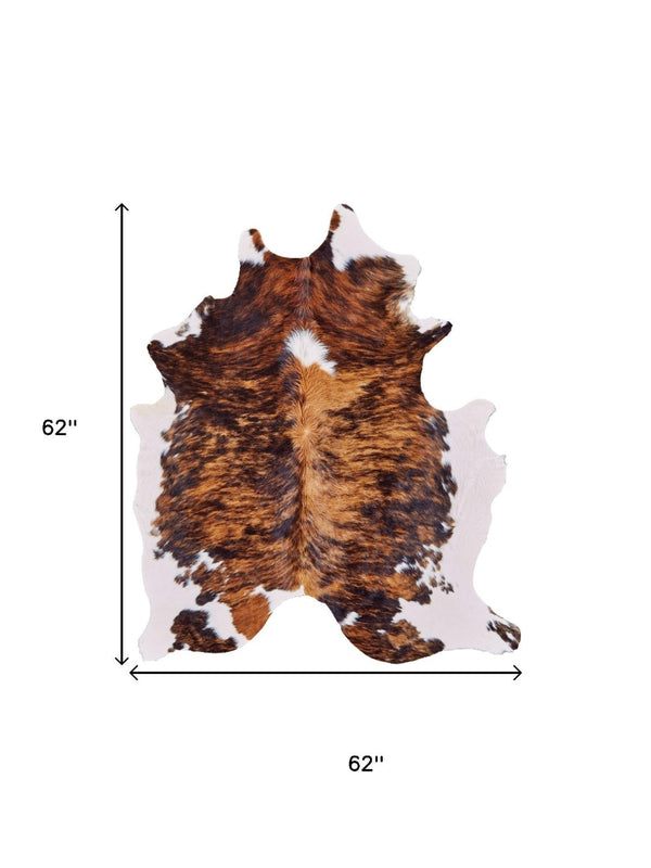 HomeRoots 4' Brown Cowhide Animal Print Power Loom Area Rug – Stylish, Durable, and Easy to Maintain for Any Room 567903