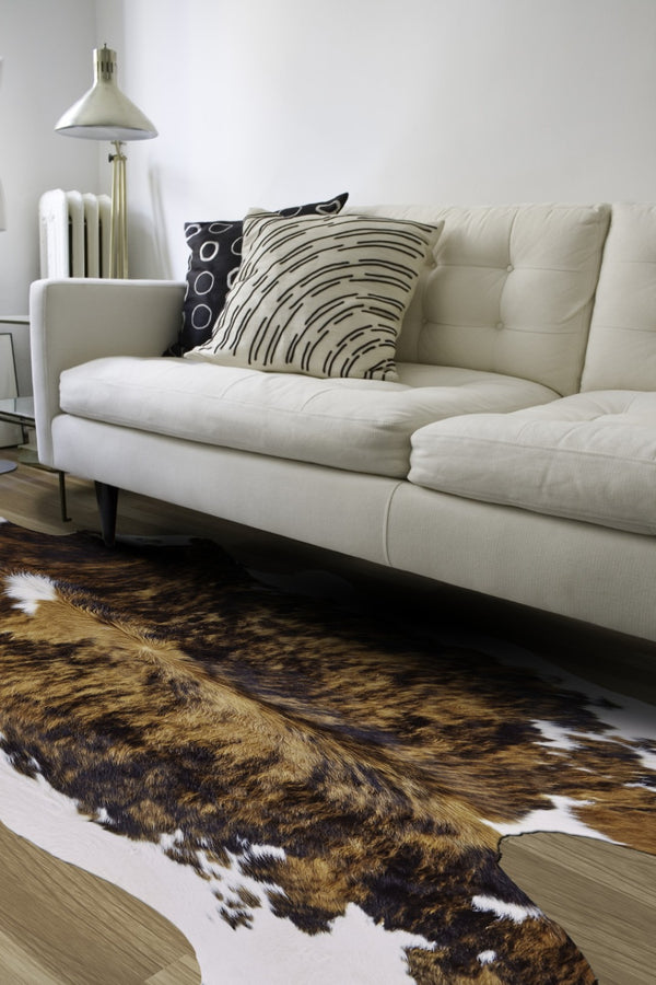 HomeRoots 4' Brown Cowhide Animal Print Power Loom Area Rug – Stylish, Durable, and Easy to Maintain for Any Room 567903
