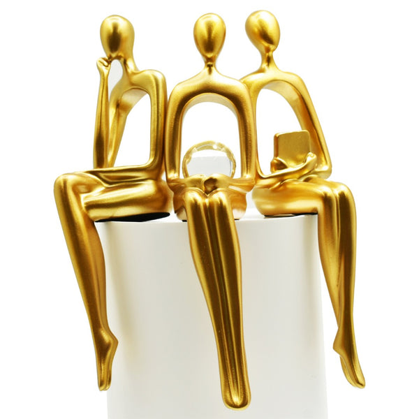 HomeRoots Set of Three Gold Resin People Sculptures - Elegant Tabletop Accents for Modern & Classic Decor 568346