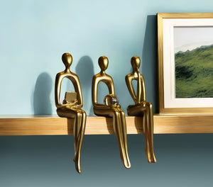 HomeRoots Set of Three Gold Resin People Sculptures - Elegant Tabletop Accents for Modern & Classic Decor 568346