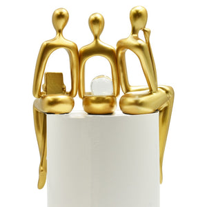 HomeRoots Set of Three Gold Resin People Sculptures - Elegant Tabletop Accents for Modern & Classic Decor 568346