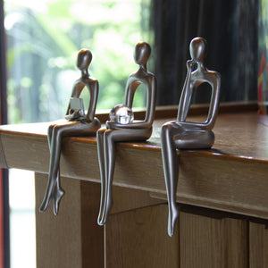 HomeRoots Set of Three Silver Resin People Sculptures - Elegant Modern Art for Home Décor & Gift Ideas 568347