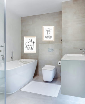 HomeRoots Set of Two Framed Bathroom Wall Art - Whimsical Toilet Paper Hanging Prints for Modern Decor 568649