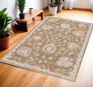 Homeroots 4' X 6' Brown Floral Power Loom Distressed Area Rug  Polyester 569666
