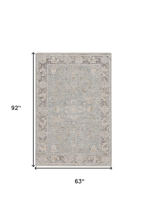 Homeroots 5' X 8' Blue Floral Power Loom Distressed Area Rug  Polyester 569668