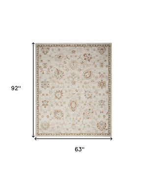 Homeroots 5' X 8' Ivory Floral Power Loom Distressed Area Rug  Polyester 569669