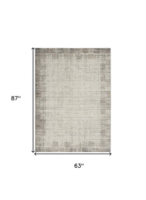 Homeroots 5' X 7' Ivory And Gray Abstract Area Rug  Polypropylene 569825