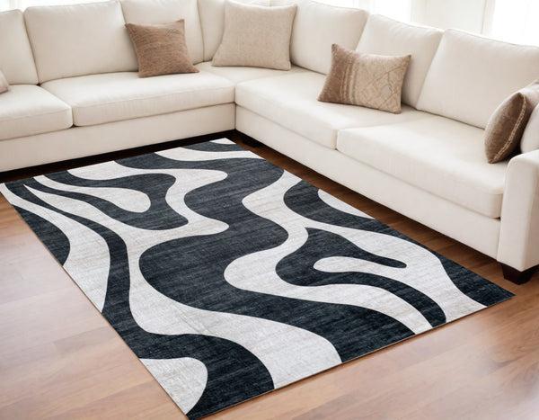 Homeroots 5' X 8' Black And White Zebra Print Area Rug  Polyester 570048