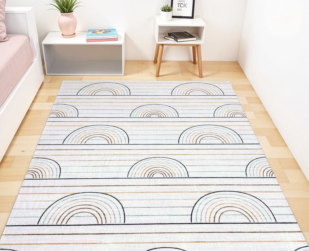 HomeRoots 5' Cheerful Ivory Blue and Yellow Rainbow Area Rug for Kids' Playrooms and Bedrooms, Durable Design 7' X 10' 570102