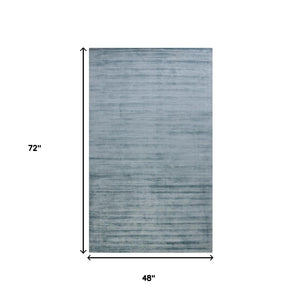 HomeRoots 4' Hand-Woven Striped Area Rug in Light and Dark Blue – Artisan Crafted for Cozy Spaces & Style 4' X 6' 570243