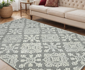 HomeRoots 5' Gray and Ivory Wool Hand-Hooked Oriental Area Rug – Artisanal Charm for Any Interior Space 5' X 7' 570344