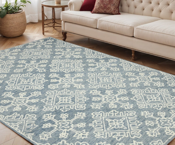 HomeRoots 5' Sky Blue and Ivory Hand-Hooked Wool Oriental Area Rug - Timeless Elegance for Any Space 5' X 7' 570352