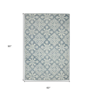 HomeRoots 5' Sky Blue and Ivory Hand-Hooked Wool Oriental Area Rug - Timeless Elegance for Any Space 5' X 7' 570352