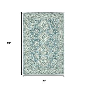 HomeRoots 5' Aqua and Ivory Wool Geometric Area Rug - Hand-Hooked Artisan Design for Modern Spaces, 60" x 90" 5' X 7' 570364