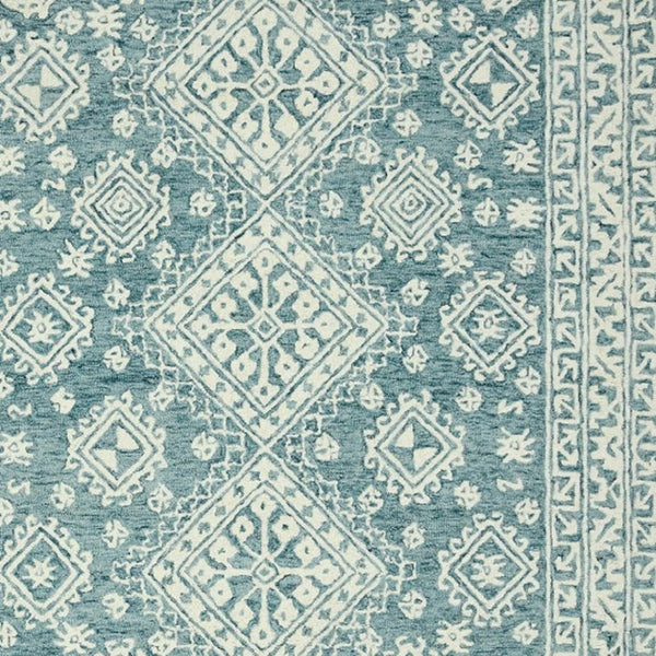 HomeRoots 5' Aqua and Ivory Wool Geometric Area Rug - Hand-Hooked Artisan Design for Modern Spaces, 60" x 90" 5' X 7' 570364